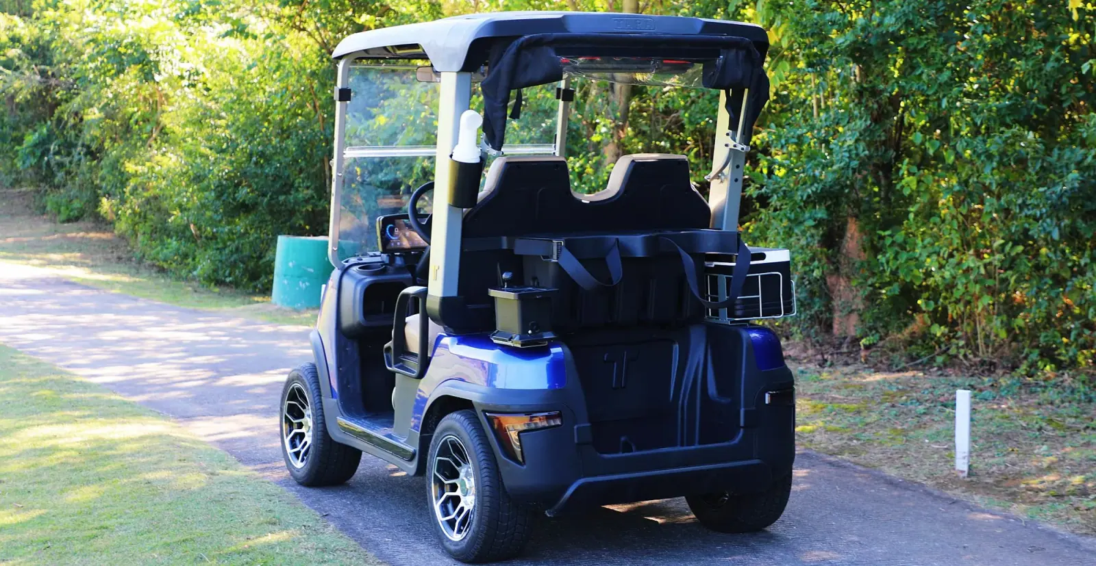 TARA Personal Transportation Vehicles Driving on Golf Course