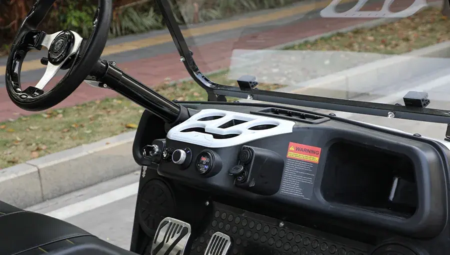 Dashboard of Tara electric golf cart featuring digital speedometer, USB charging port, and control panel