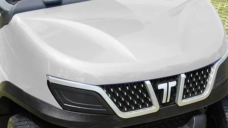 Close-up of Tara golf cart front end showcasing aerodynamic styling and sturdy construction for enhanced performance