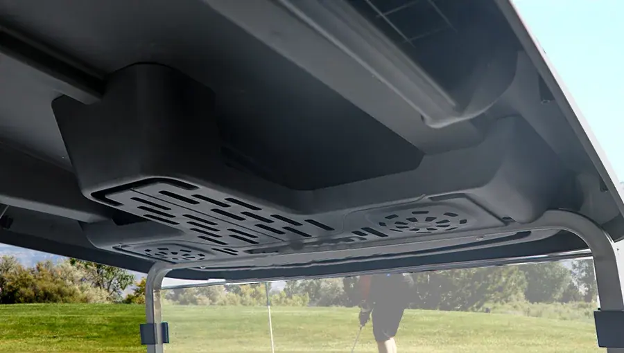 Close-up of Tara golf cart storage compartment located under the roof, providing secure and easy-to-reach storage