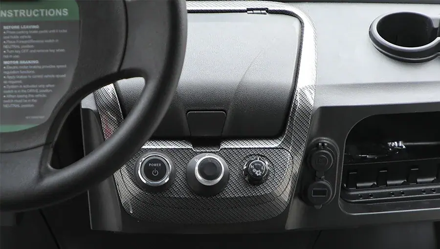 Interior view of Tara golf cart showing well-organized control switches within reach of the driver