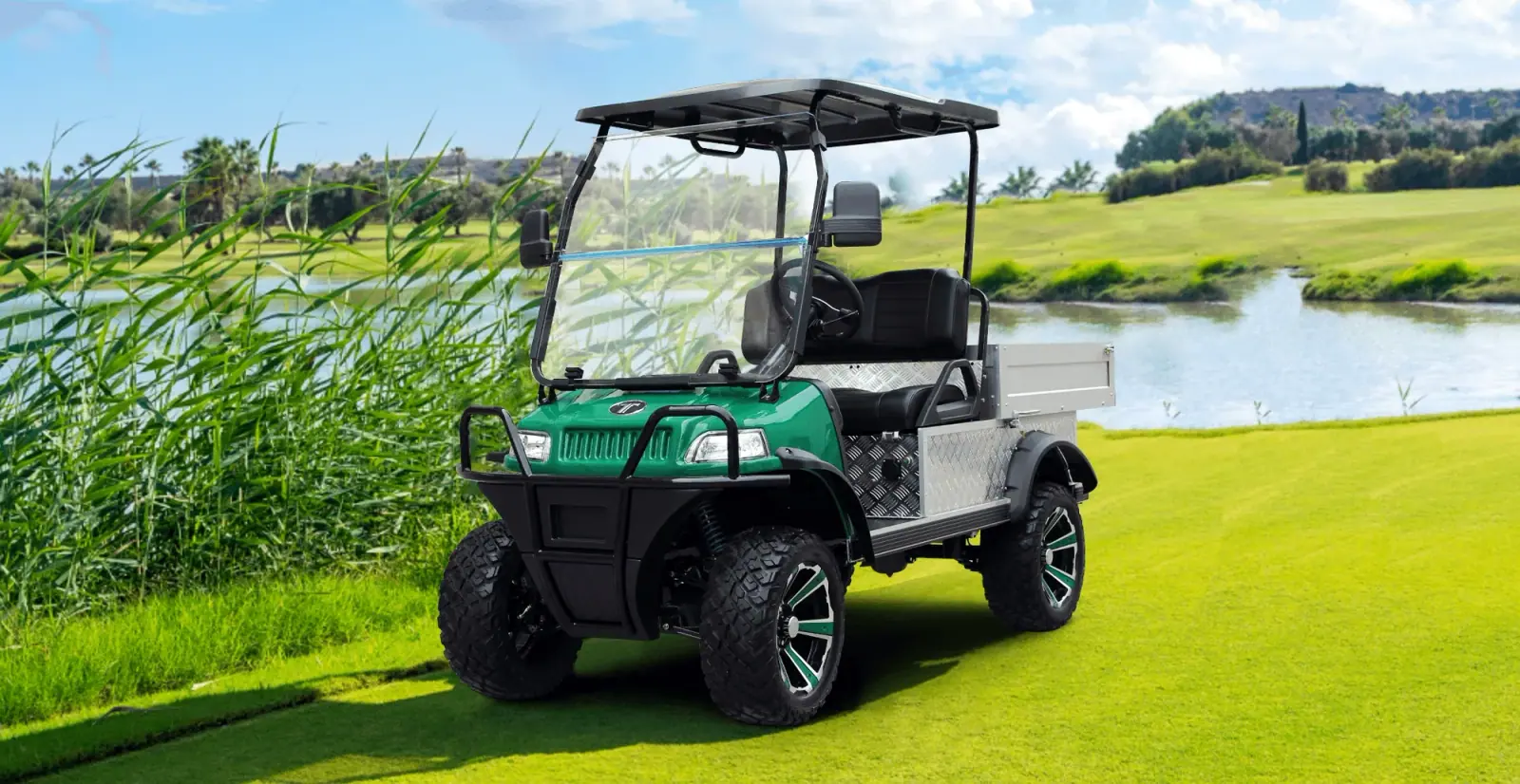 Turfman 700 Electric UTV Operating on Grass Field
