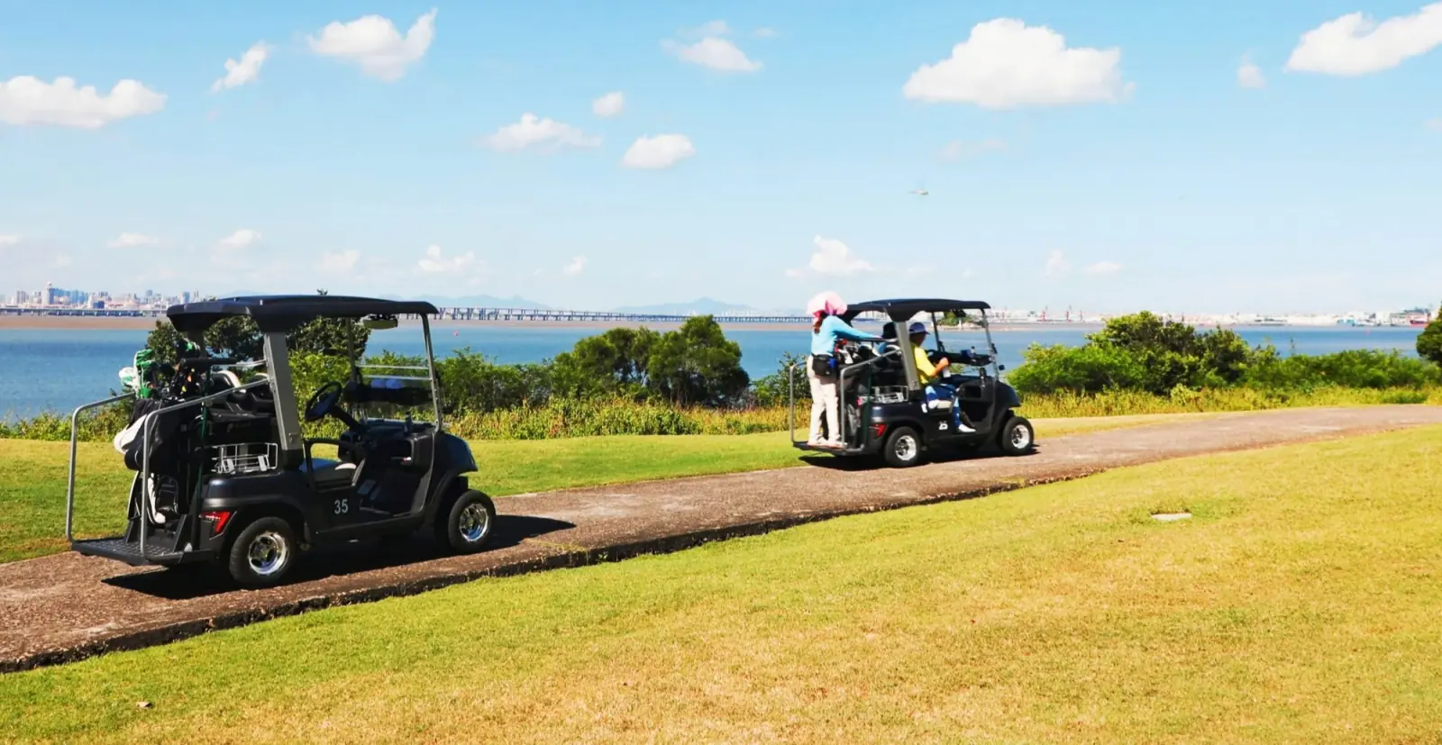 Tara Harmony Golf Cart Driving on Golf Course